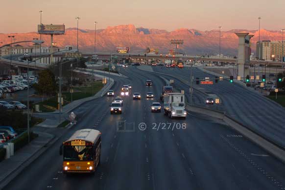 DSC color photo: Sunrise view of eastbound traffic on Tropicana Blvd; viewed from pedestrian overpass - Embedded text: 2/27/08