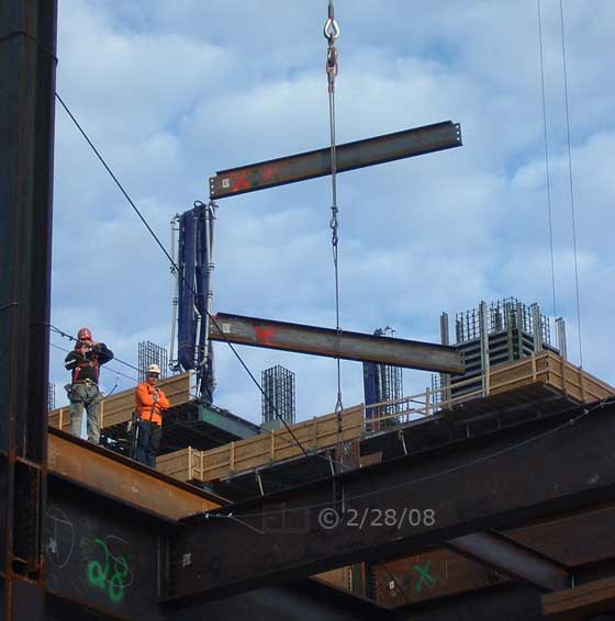 DSC color photo: Iron girders being moved on construction site  - Embedded text: 2/28/08