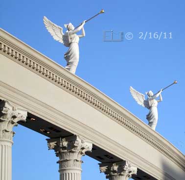 DSC color photo: Caesars Palace angels blowing horns - Embedded text: 2/16/11