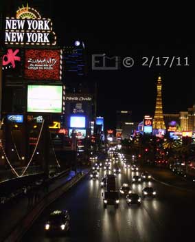 DSC color photo: Nighttime view of Las Vegas Blvd from pedestrian overpass, looking north  - Embedded text: 2/17/11