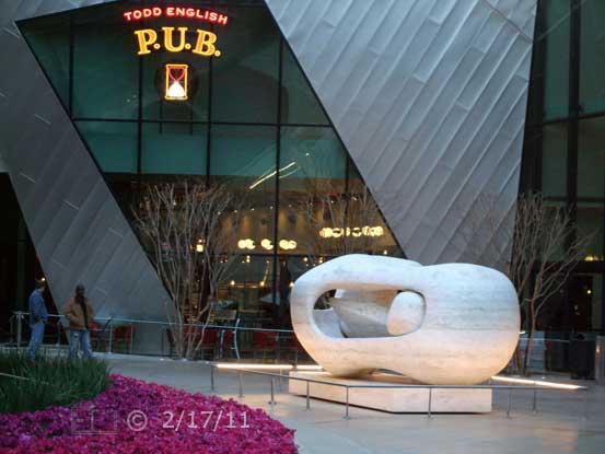 DSC color photo: Art sculpture in front of area businesses - Embedded text: 2/17/11