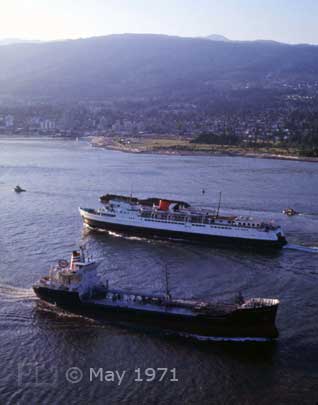 Color photo: Ships passing each other on Burrard Inlet - Embedded text: May 1971