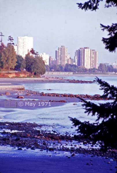 Color photo: Vancouver high-rises viewed from Stanley Park near sunset - Embedded text: May 1971