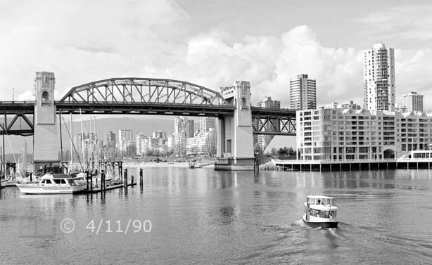 B/W photo: Pedestrian ferry headed towards Granville Bridge - Embedded text: 4/11/90
