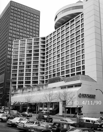 B/W photo: A radial/rotunda top floor on a rectangular high-rise building - Embedded text: 4/11/90
