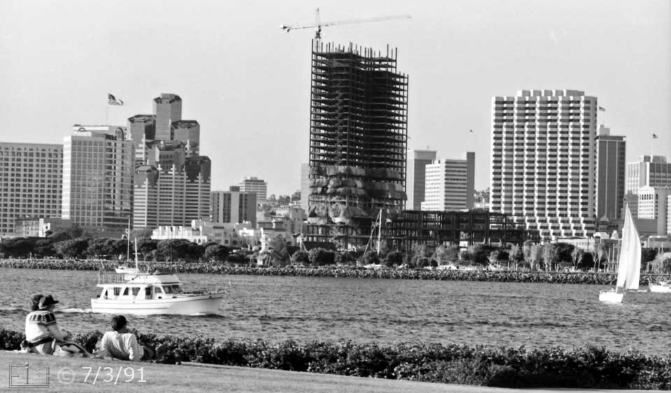 B/W photo: Coronaso sightseers view boats on the bay and San Diego skyline - Embedded text: 7/3/91