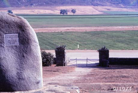 E6 Color image: View from behind masonry fence in back of monument