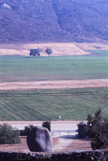 E6 Color image: View from behind masonry fence in back of monument